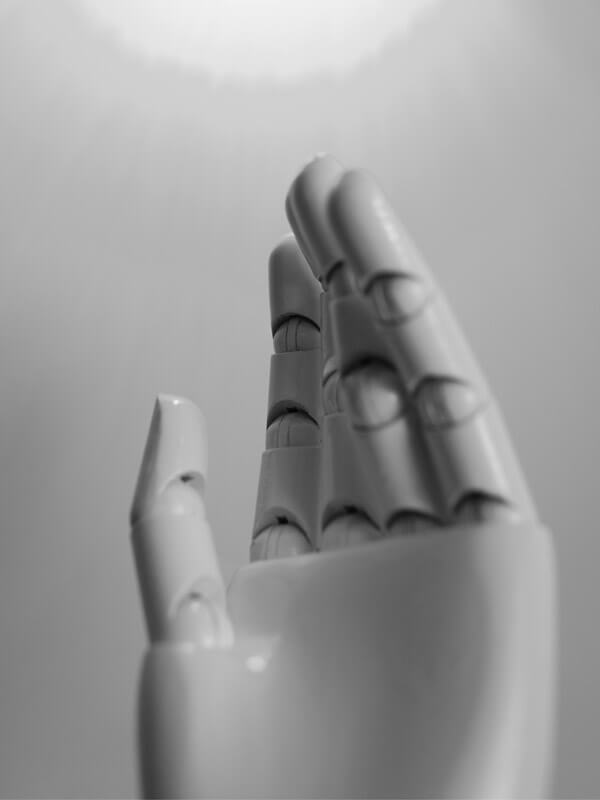 A robotic hand pointing upwards